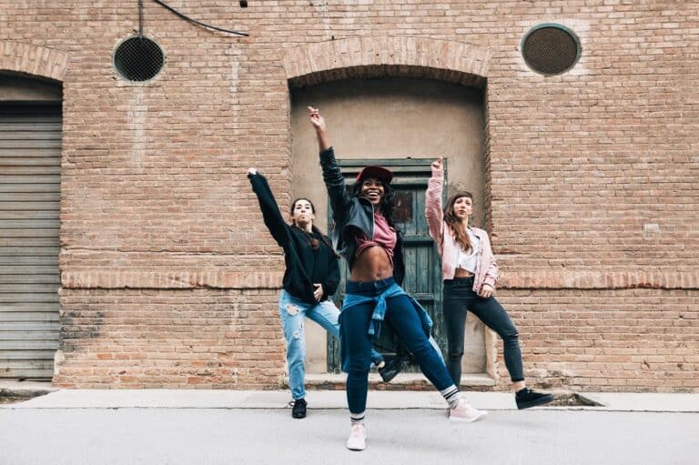 Three Female Dancing Hip Hop In The Street.